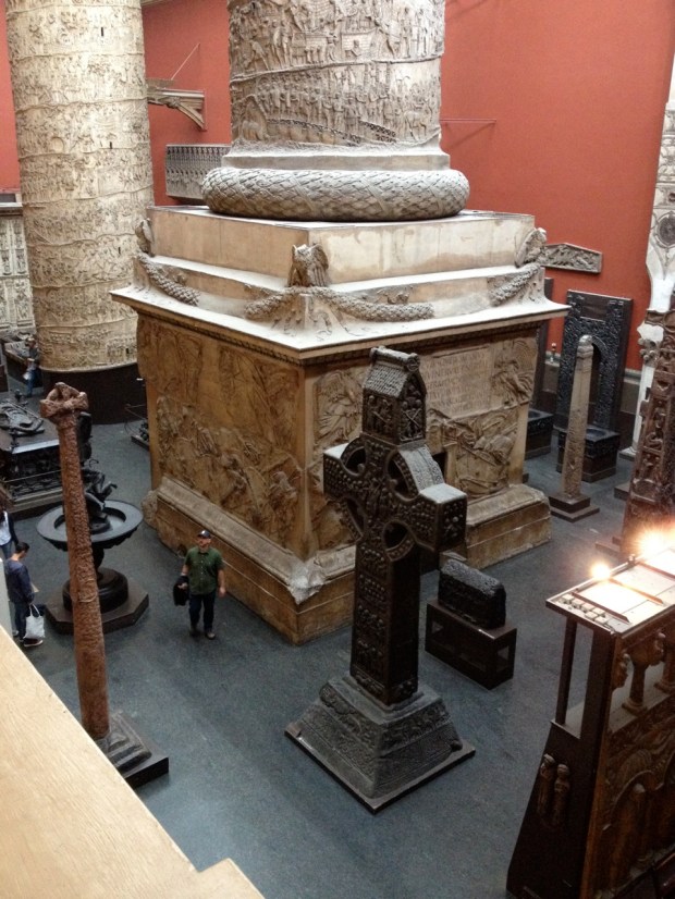 Perspective on that huge pillar. Took this photo from the balcony above. Look at the relative height of the man standing beside it!