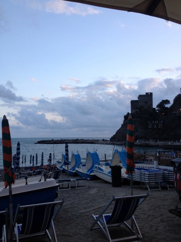 The view of the sunset over Monterosso's pier and castle from our dinner table 