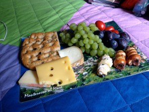 Post-swim picnic, set out on one of the scenic photograph placemats we bought in Corniglia.